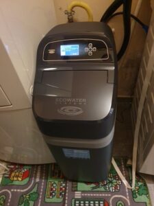 EcoWater water softener installed in a utility room, a MICHLOR project