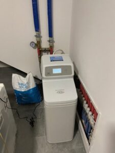 EcoWater water softener installed in a utility room, a MICHLOR project
