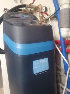 Water filter and EcoWater softener installed in a utility room