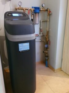 EcoWater softener with the lid open, showing the salt tank