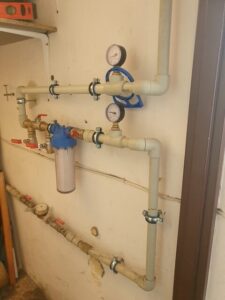 Water filter and EcoWater softener installed in a utility room