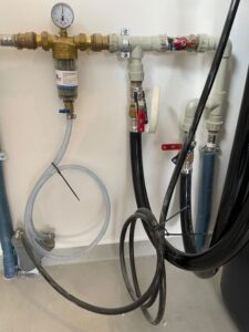 EcoWater softener connected to a system with a pressure vessel, installed by MICHLOR