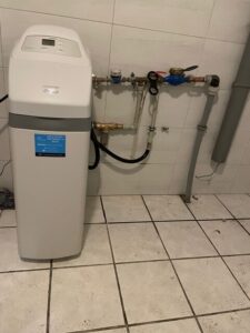 EcoWater softener connected to a system with a pressure vessel, installed by MICHLOR
