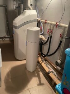 EcoWater softener connected to a system with a pressure vessel, installed by MICHLOR